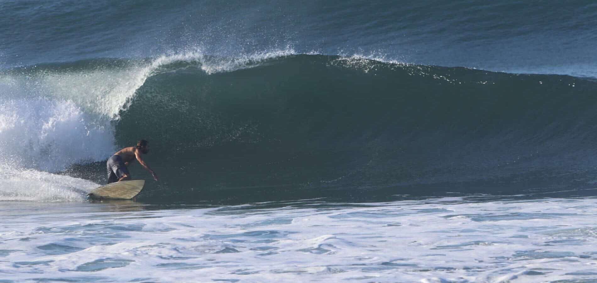 Surf session in El Salvador on a tubular left during a surf trip with Surf Travel
