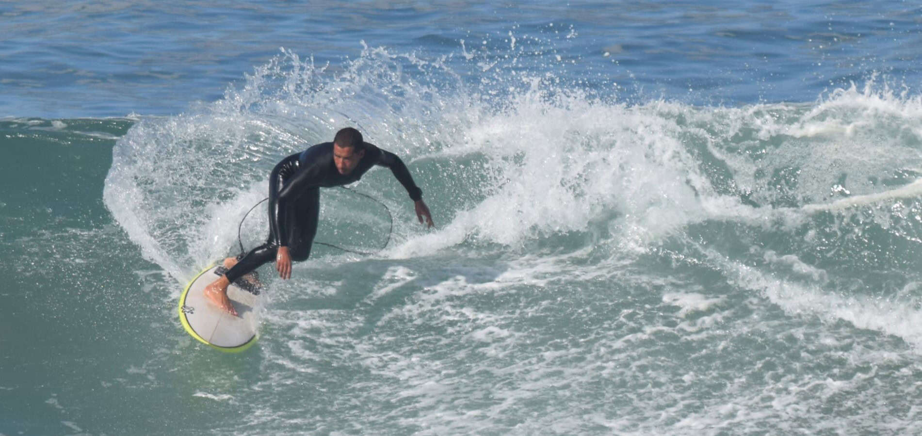 Surfing guy in Bouznika, Morocco